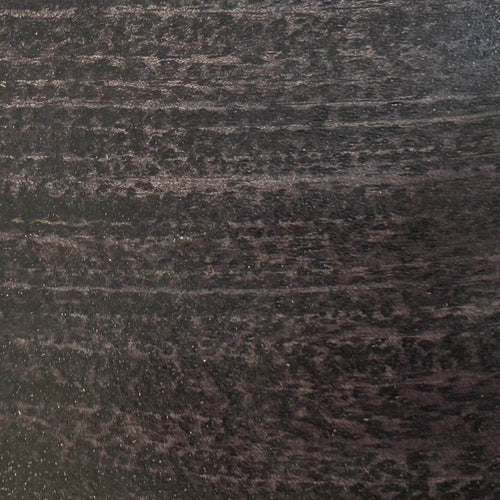 Close-up of a textured dark brown surface