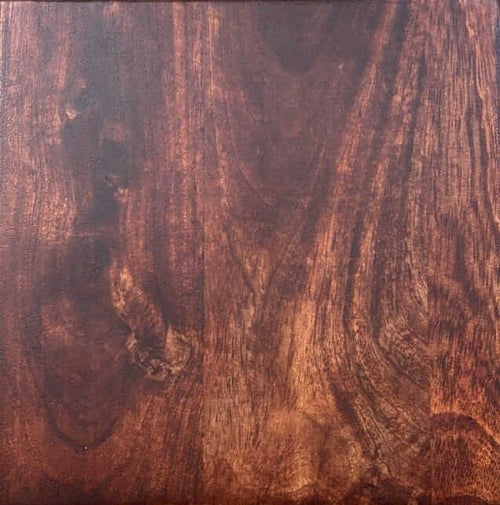 Close-up of a wooden surface with a rich brown and red pattern