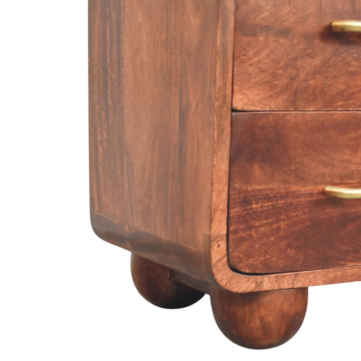 Close-up of the 3-drawer mango wood nightstand showcasing the rounded corners and wooden texture.
