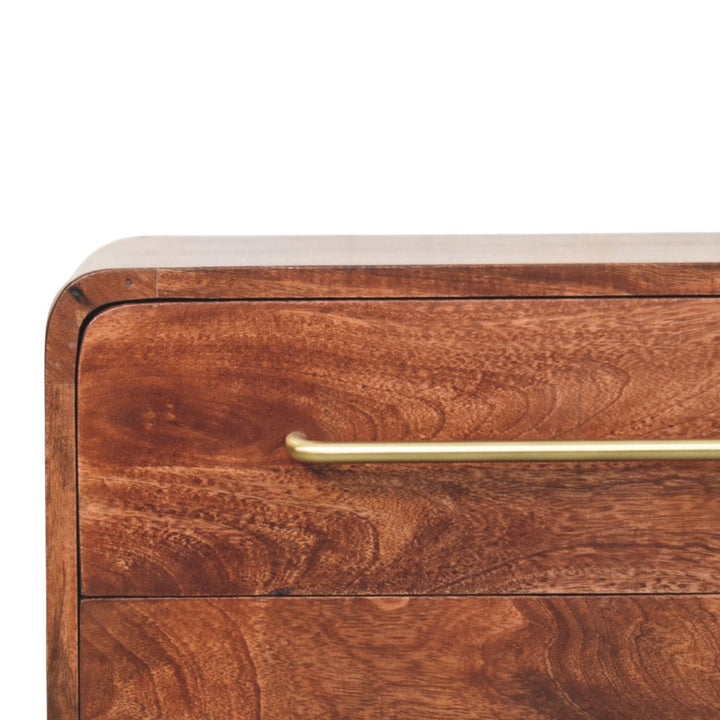 Close-up of the 3-drawer mango wood nightstand in winewood oak finish with a gold handle.