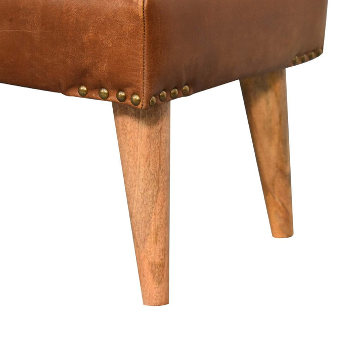 Handcrafted mango wood bench with rustic leather upholstery and solid wooden legs, ideal for entryway or living space.