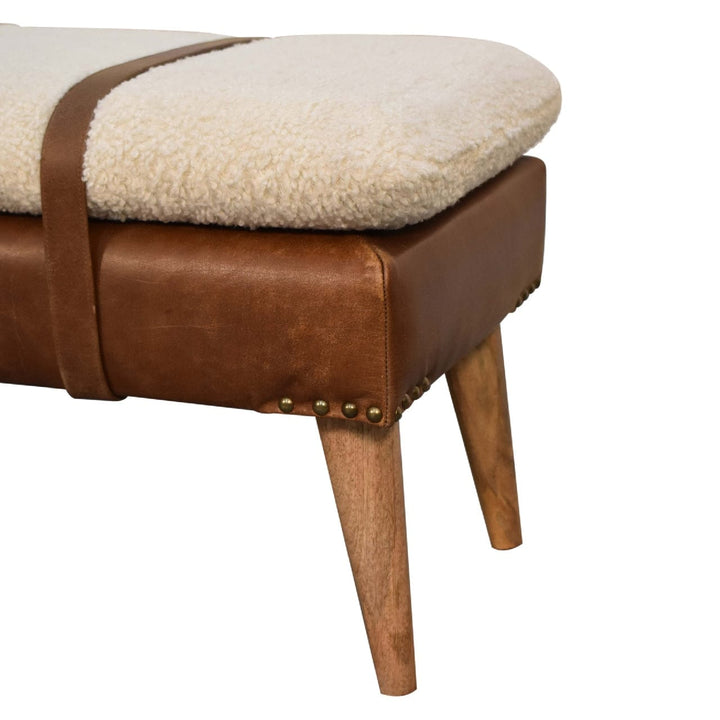 Handcrafted mango wood bench with boucle buffalo hide leather seat and sturdy wooden legs, perfect for stylish entryway seating.