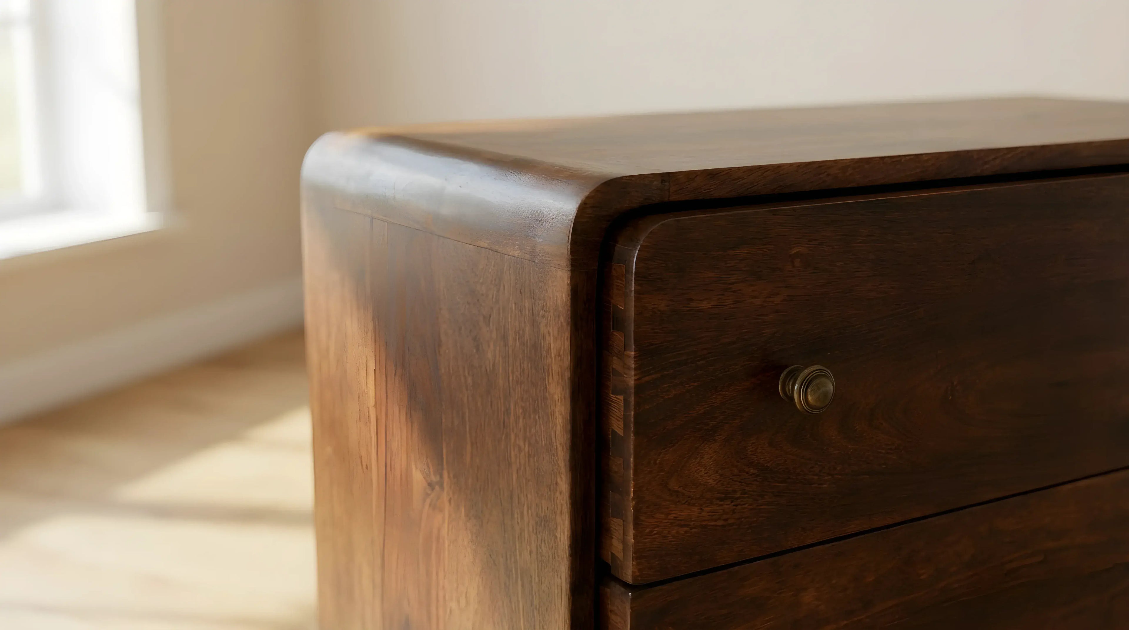 Wooden drawer with a knob in a softly lit room