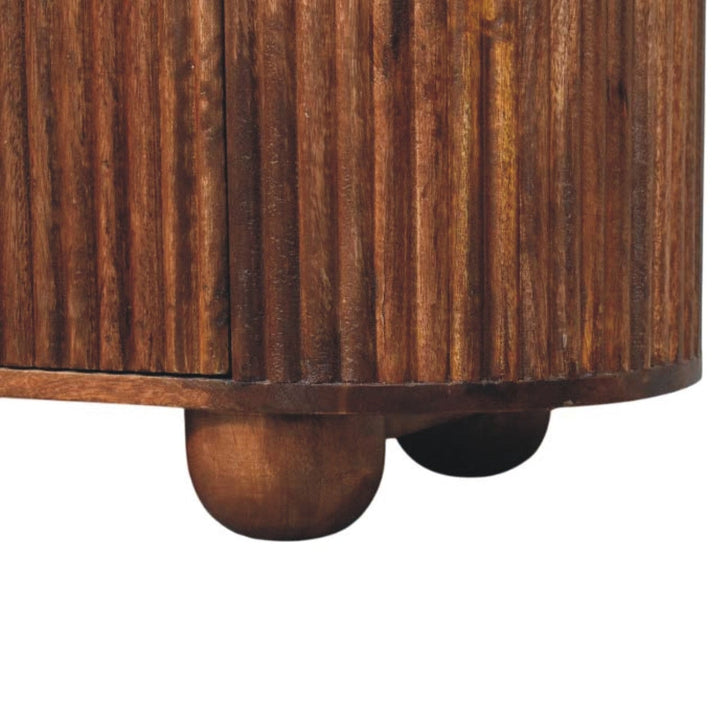 Rustic Ridgefront Dresser - Solid Mango Wood Storage Chest for Bedroom with unique ribbed texture and round wooden feet.