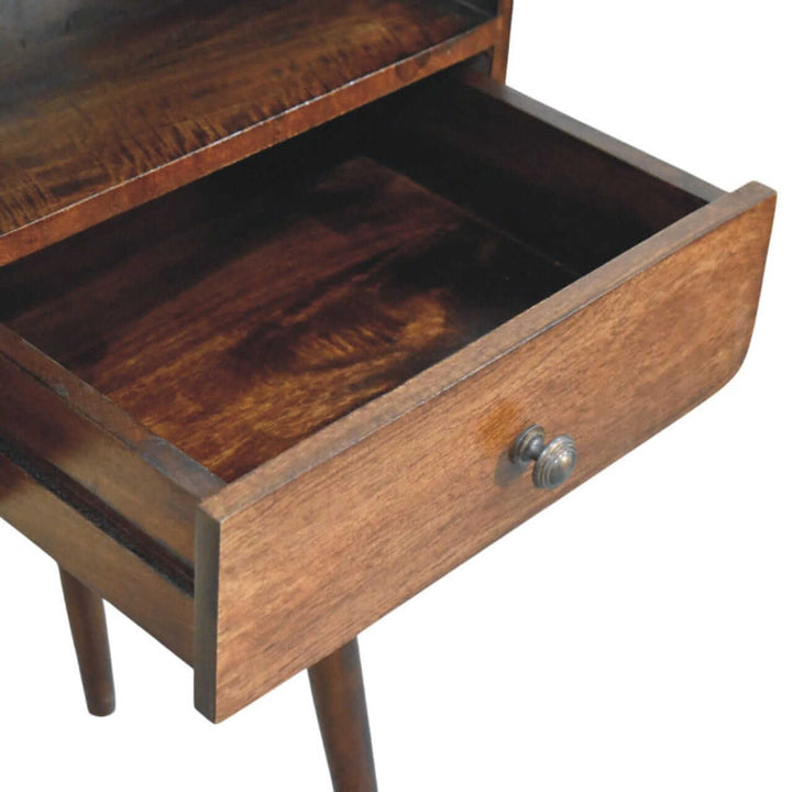 Close-up of the open drawer of a mid-century three drawer console table showcasing the rich wood finish.