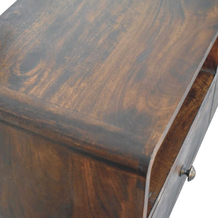 Close-up of the surface of the mid-century three drawer console table showcasing rich walnut tones and natural wood grain.